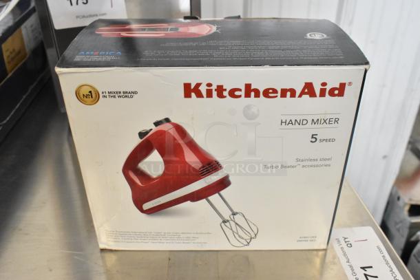 KitchenAid KHM512ER 5-speed hand mixer in Empire Red, stainless steel Turbo Beaters. New with box damage. 120V, 1 Phase.