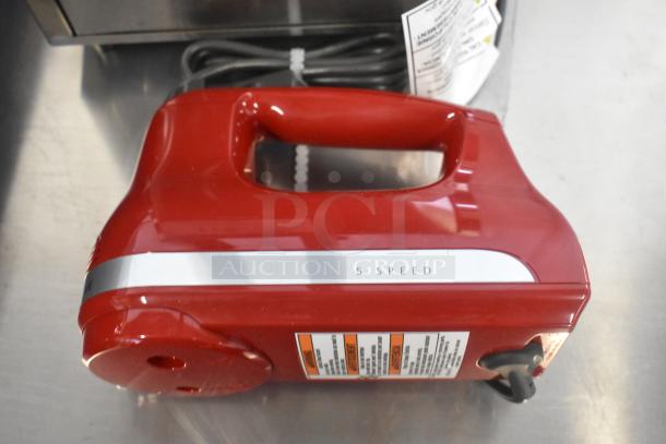 Brand new KitchenAid KHM512ER 5-Speed Hand Mixer, Empire Red, with stainless steel turbo beaters, 120 volts, minor scratches.