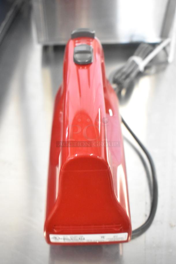 KitchenAid KHM512ER Ultra Power 5-Speed Hand Mixer in Empire Red. New scratch and dent, 120 volts, with labels.