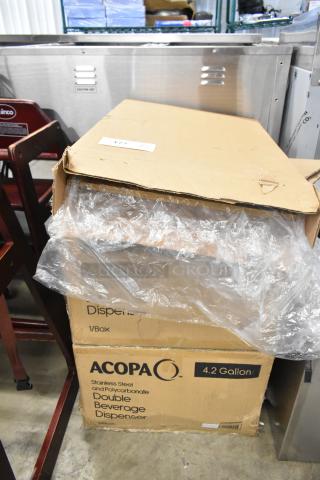 Boxes of Acopa 2.1-gallon stainless steel and polycarbonate beverage dispensers, brand new, some scratch and dent.