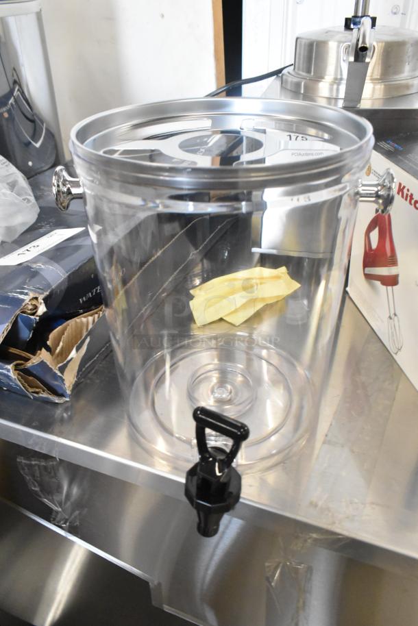 Acopa 2.1-gallon stainless steel and polycarbonate beverage dispenser, new condition, poly lids included, minor box damage.