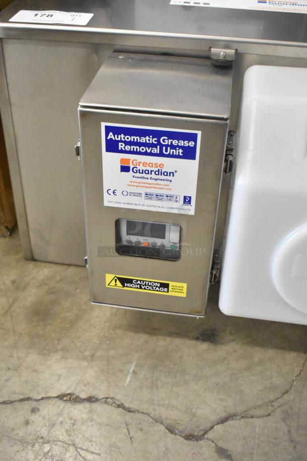 BRAND NEW Scratch & Dent FM Environment 50 lb Stainless Steel Automatic Grease Removal Unit. Visible control panel and caution label.