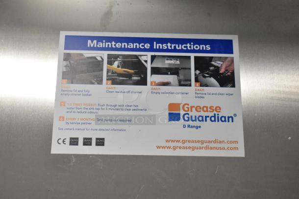 Stainless steel FM Environment 50 lb automatic grease removal unit, brand new with minor scratches and dents. Includes maintenance instructions.