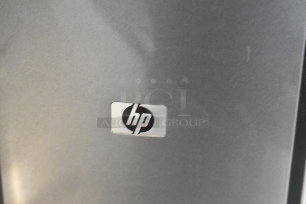 HP Pavilion computer tower with visible HP logo.