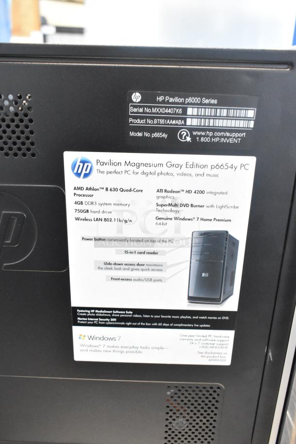 Toshiba monitor paired with HP Pavilion p6654y tower, featuring AMD Athlon II 630, 4GB RAM, 750GB HDD, Windows 7.