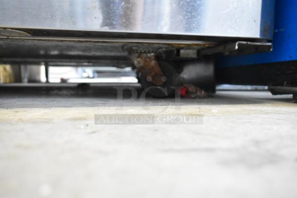 Turbo Air MUR-48 stainless steel undercounter cooler on casters, visible wear, 115V, 1 phase, suitable for commercial use.