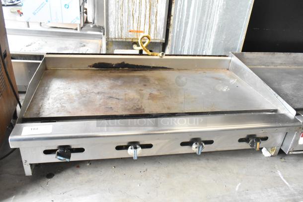 Radiance stainless steel commercial gas griddle; flat top, three control knobs, some surface wear visible.