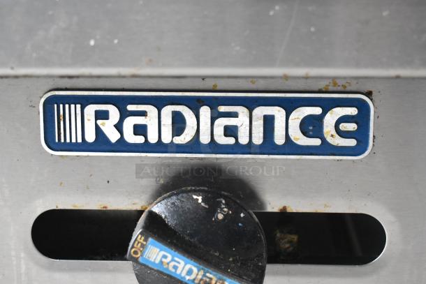 Radiance Stainless Steel Gas Griddle with control knob; features visible logo, some wear, suitable for commercial use.