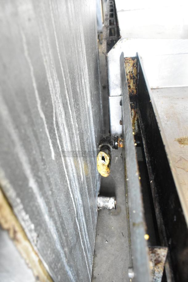 Radiance stainless steel commercial countertop gas griddle, visible gas connection valve, some wear and discoloration.