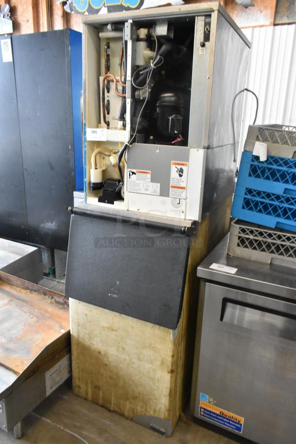 Hoshizaki KM-515MAH stainless steel ice machine head on commercial bin. 115-120 volts, 1 phase. Visible operational labels.