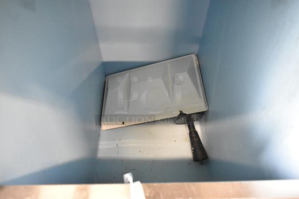 Hoshizaki KM-515MAH ice machine head on commercial bin. Stainless steel, 115-120V, 1 phase, interior view of bin.