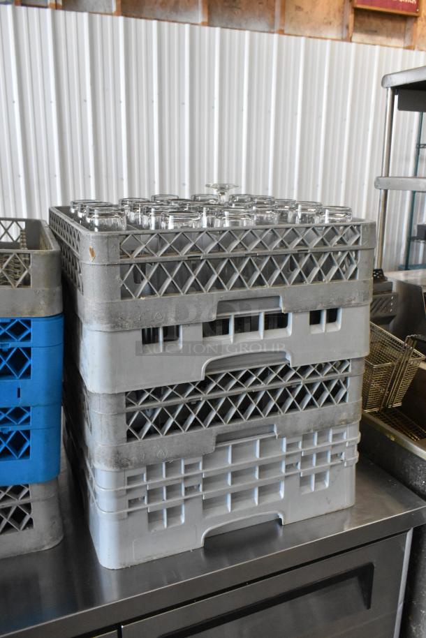 8 poly dish caddies stacked, each holding 19 beverage glasses. Used condition, ideal for bulk purchase.