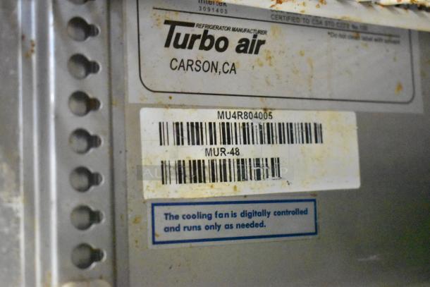 Turbo Air MUR-48 label with model number, barcode, and condition details on stainless steel undercounter cooler.