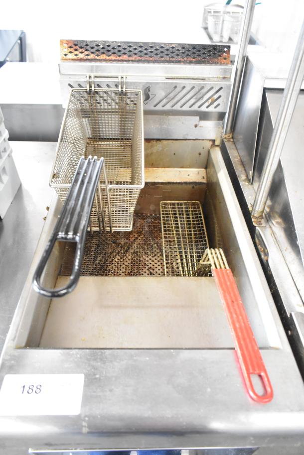 2022 Venancio RFB50 stainless steel commercial fryer, natural gas, 30,000 BTU, with metal fry basket, shows some wear.