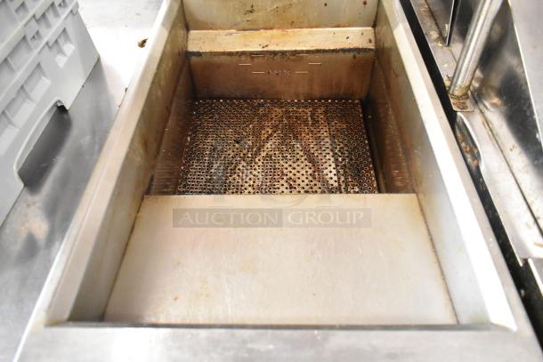 2022 Venancio RFB50 stainless steel commercial fryer, natural gas, 30,000 BTU, with metal fry basket, showing interior condition.
