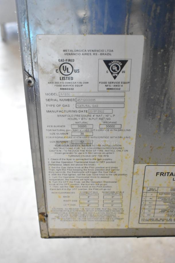 2022 Venancio RFB50 stainless steel commercial gas fryer, 30,000 BTU, with metal fry basket. Label shows model and specs.