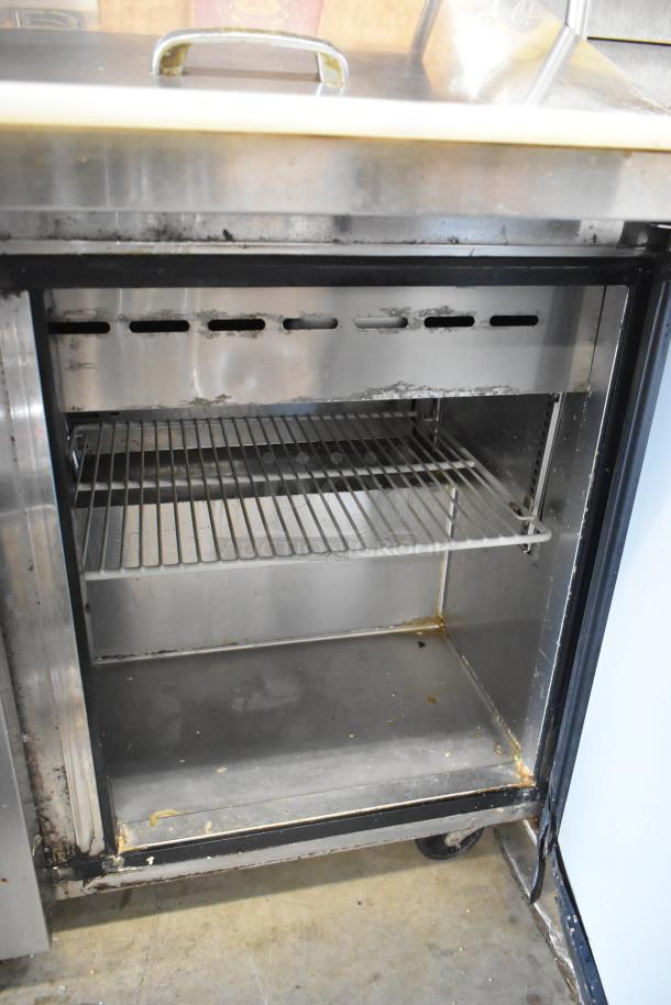 Turbo Air MST-72-30 stainless steel sandwich prep table with 2-tier overshelf, interior shelving, on commercial casters.