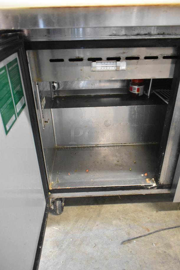 Turbo Air MST-72-30 sandwich salad prep table, stainless steel interior, visible wear. 115V, 1 phase, on commercial casters.