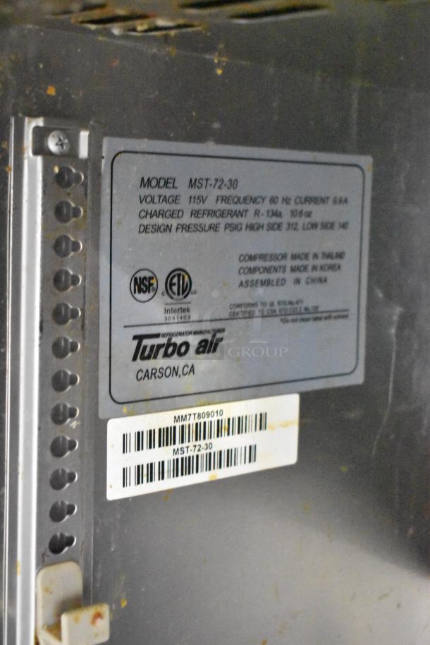 Turbo Air MST-72-30 label showing model details, voltage (115V), refrigerant type (R-134a), and certifications (NSF, ETL).