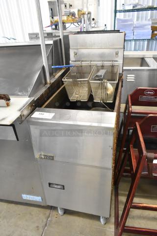 Pitco Frialator SG14 stainless steel commercial deep fryer with 2 metal baskets, natural gas powered, 110,000 BTU.