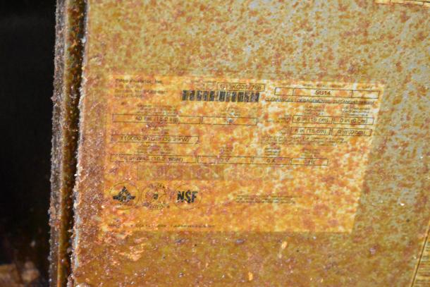 Pitco Frialator SG14 label, showing model number and specifications on a rusty stainless steel deep fat fryer surface.