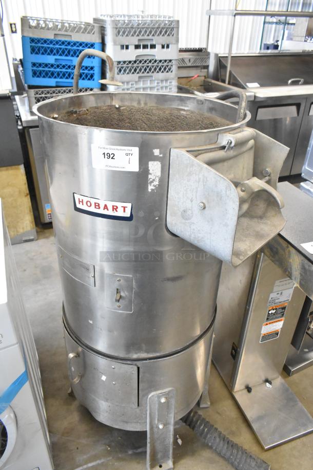 Hobart metal commercial floor-style potato peeler in good condition. Features stainless steel body; model details not specified.