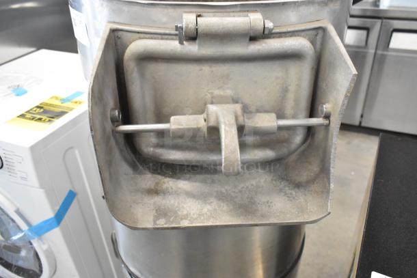 Hobart metal commercial floor-style potato peeler, sturdy metal construction, visible wear, suitable for high-volume kitchens.