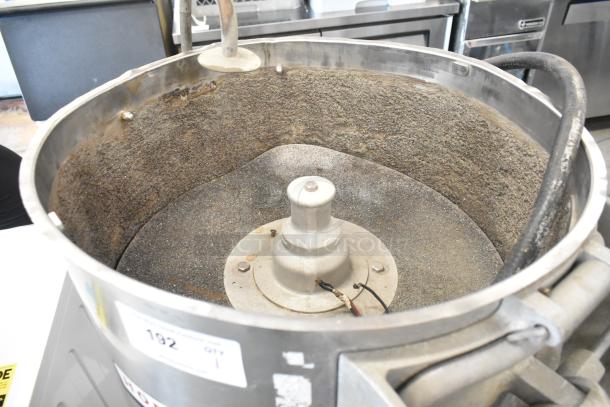 Hobart metal commercial floor-style potato peeler, interior view. Stainless steel body, visible wear, functioning condition.