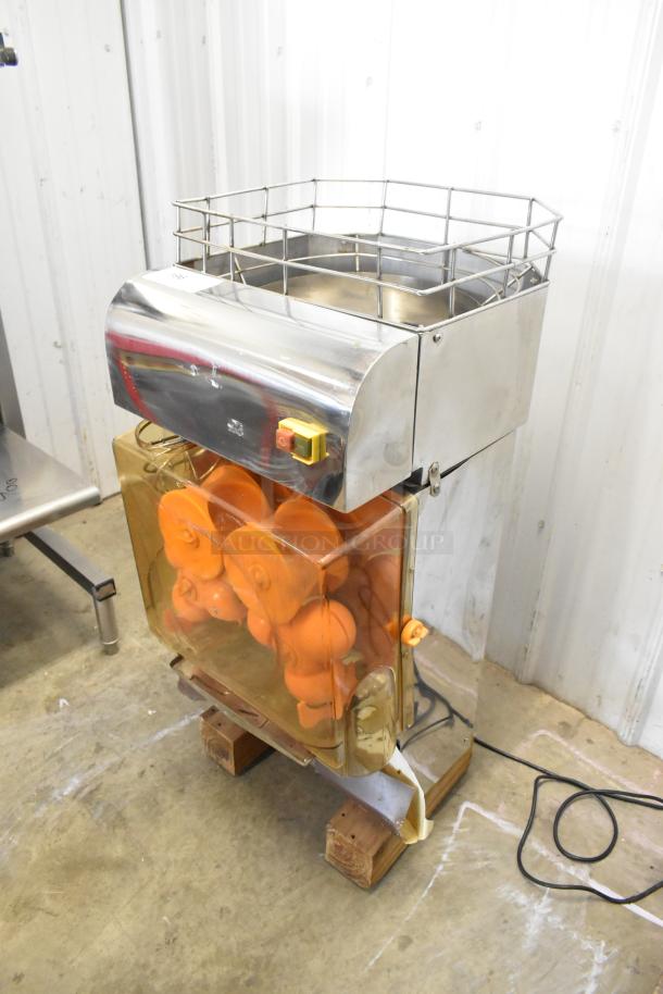 Stainless steel commercial countertop citrus juicer, 115 volts, 1 phase, durable construction, orange juicing mechanism visible.