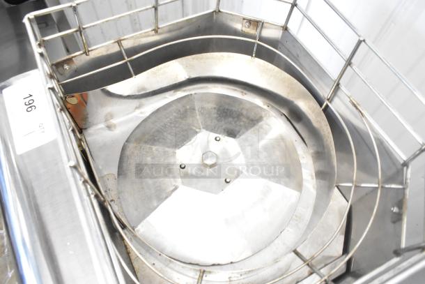 Stainless steel commercial countertop citrus juicer, 115 Volts, 1 Phase, shown with durable metal construction and safety cage.