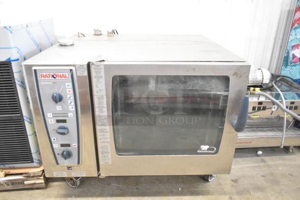2016 Rational CMP 62G stainless steel combi convection oven with casters, good condition, control panel visible.