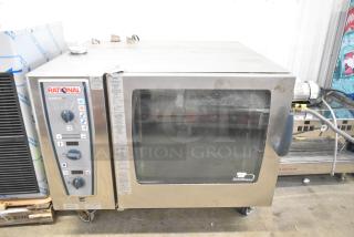2016 Rational CMP 62G stainless steel combi convection oven with casters, good condition, control panel visible.