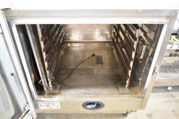 2016 Rational CMP 62G stainless steel combi convection oven; natural gas powered; on casters; interior view; used.