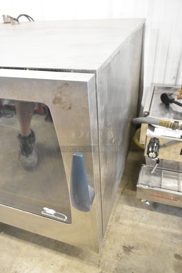 2016 Rational CMP 62G stainless steel combi oven, natural gas, on commercial casters, visible wear, whited efficiency logo.