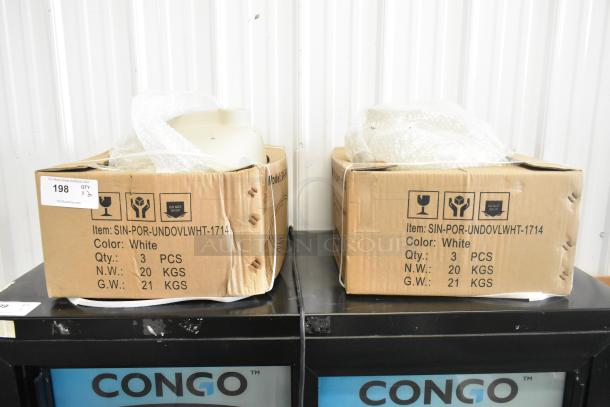 2 brand new SIN-POR-UNDOVLWHT-1714 white undermount vanity sinks in boxes. Labeled as scratch and dent items.