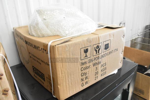 Brand new SIN-POR-UNDOVLWHT-1714 undermount vanity sink in white. Two sinks bundled, boxed with protective wrap.