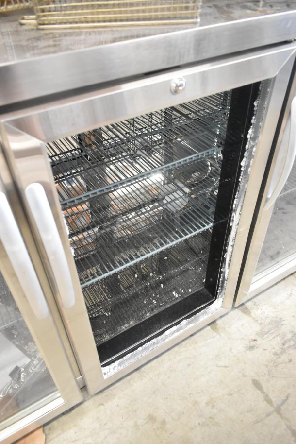 BRAND NEW KoolMore KM-BC-3GD-3C33 3-door cooler, stainless steel, broken glass visible, 115V, 1 phase, commercial use.