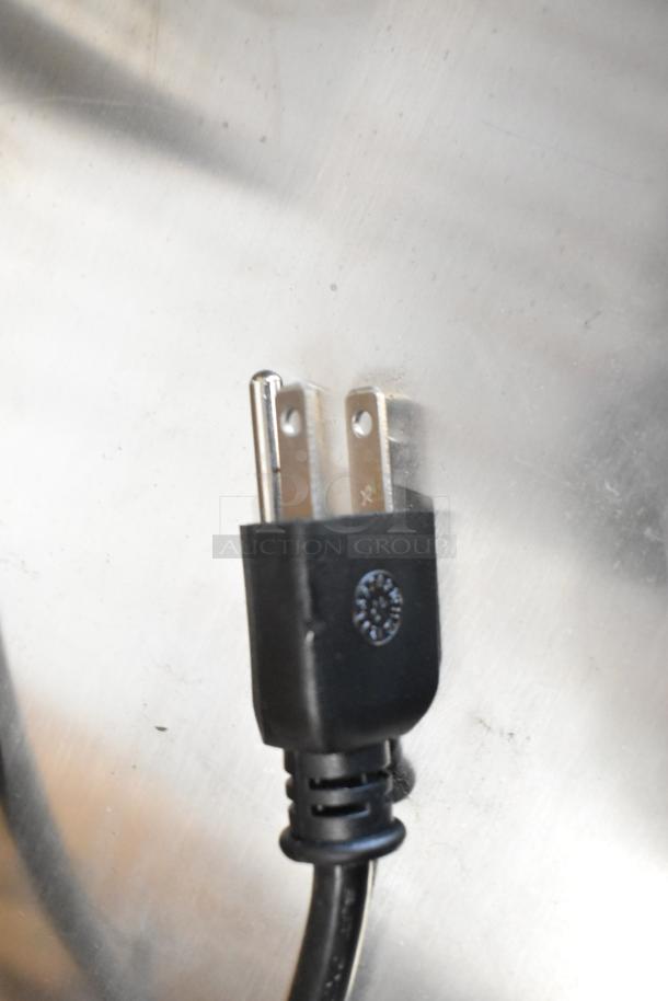 Plug of KoolMore KM-BC-3GD-3C33 back bar cooler showing standard power cord for 115 volts, 1 phase connection.
