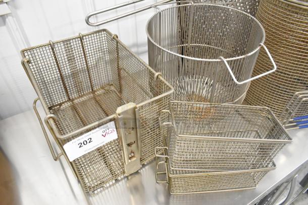 Metal fry baskets and bins, varying sizes, mild wear, label "202 QTY23", auction item, bids multiplied by 23.