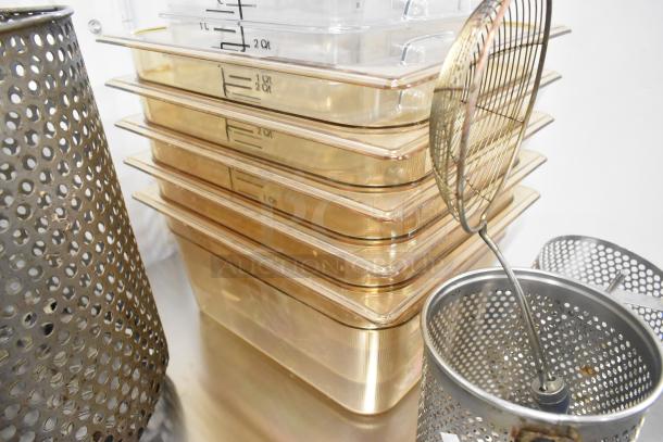 Metal fry baskets and poly bins stack; some labeled with quarts and liters. Items in good condition, suitable for kitchen use.