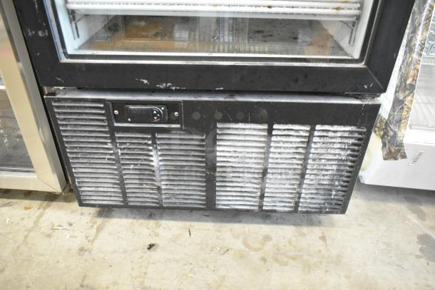 2019 Habco SE18 metal commercial single door cooler with poly coated racks. Visible wear on the front vent. 115V, 1 phase.