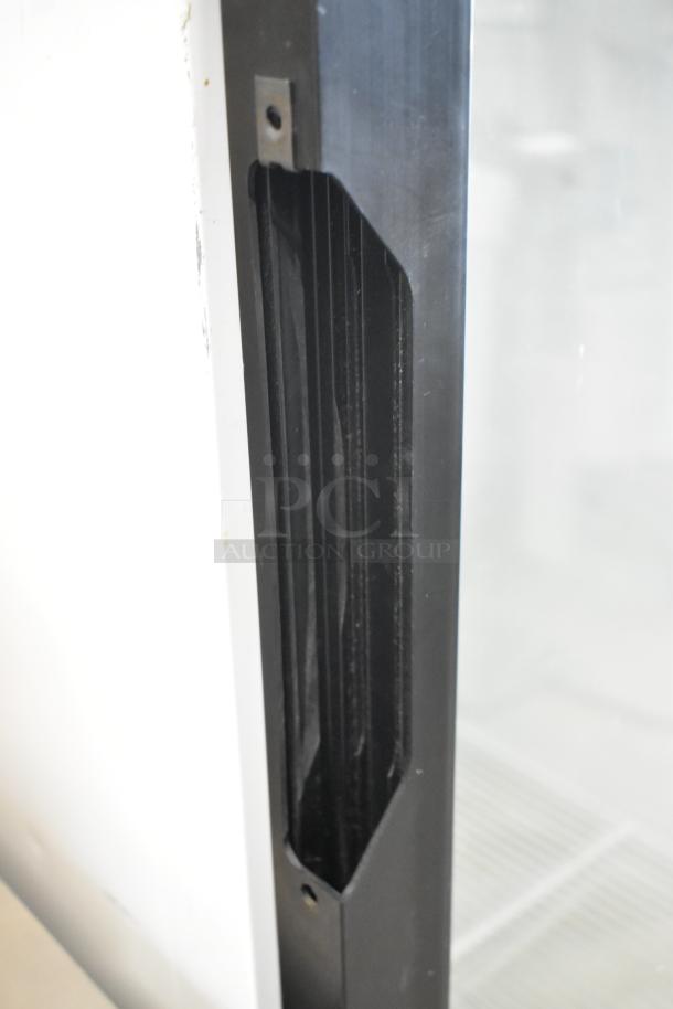 2019 Habco SE18 metal single door reach-in cooler, featuring poly coated racks, 115V, 1 phase. Close-up of door frame.