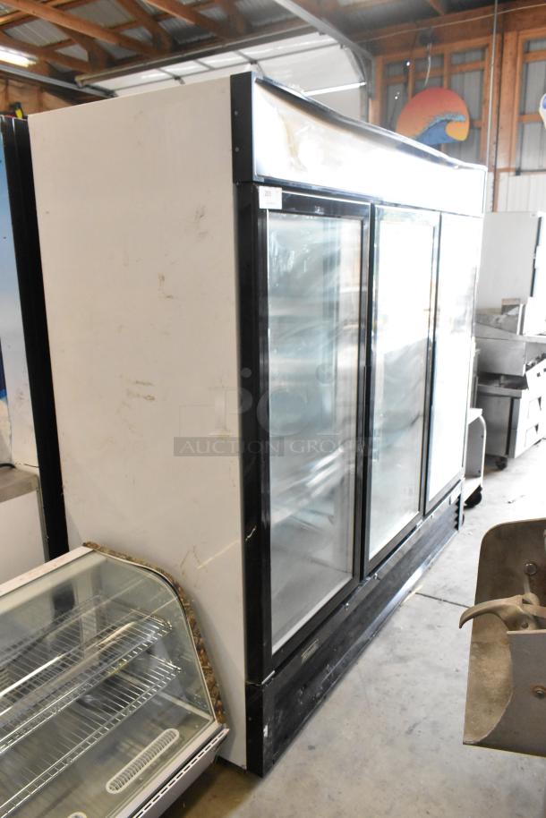 2018 Migali C-72FM metal 3-door reach-in freezer merchandiser with poly-coated racks. Used, visible wear. 115/208-230V, 1 phase.