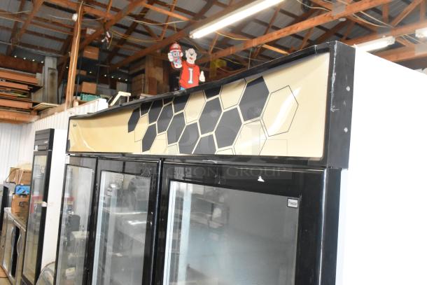 2018 Migali C-72FM commercial 3-door freezer, glass doors, poly-coated racks, 115/208-230V, 1 phase, hexagonal design.