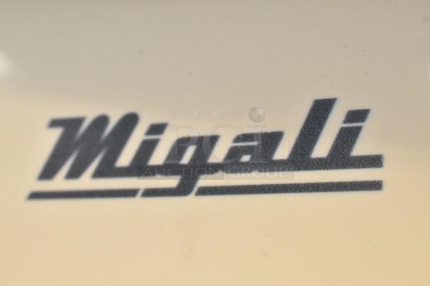 Migali logo on metal surface of 2018 Migali C-72FM commercial 3-door freezer.