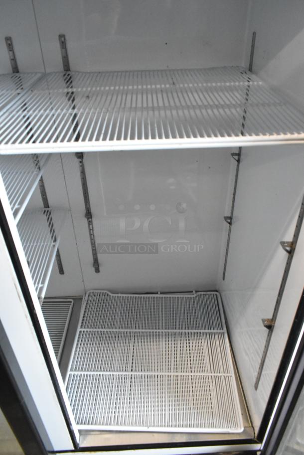 2018 Migali C-72FM 3-door reach-in freezer with poly-coated racks, commercial-grade, 115/208-230V, 1-phase.