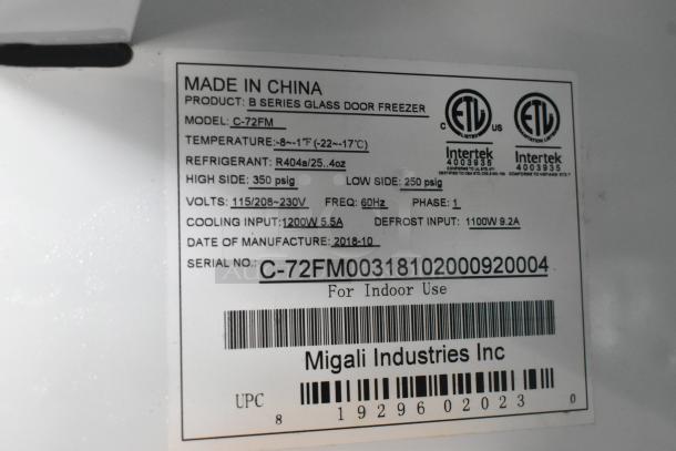 2018 Migali C-72FM 3-Door Reach-In Freezer, poly-coated racks, 115/208-230V, 1 phase. Label shows specs and serial.