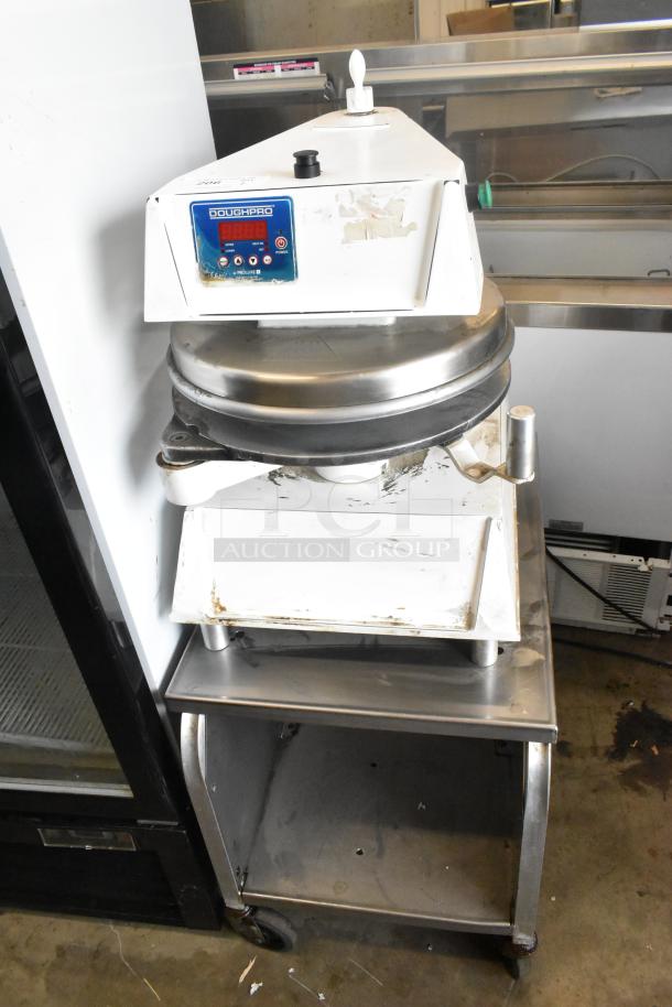 DoughPro metal commercial countertop dough press on equipment stand, runs on 115 volts, 1 phase, used condition.