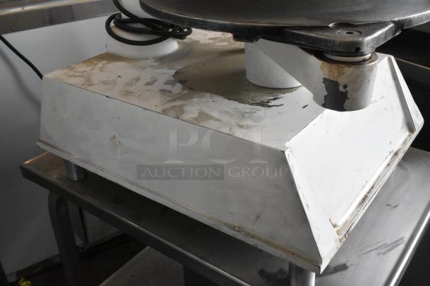 DoughPro metal commercial countertop dough press on equipment stand, 115 volts, 1 phase, visible wear and surface marks.