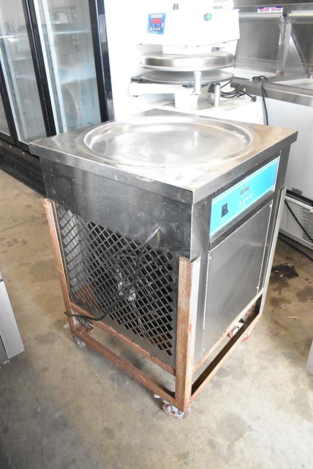 Stainless steel rolled ice cream station on commercial casters, 115V, 1 phase, visible signs of wear, includes control panel.